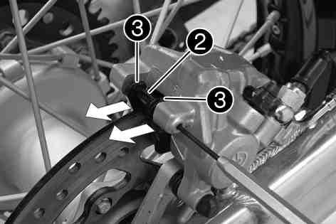 (Your authorized KTM workshop will be glad to help.) Press the brake caliper onto the brake disc by hand in order to push back the brake pistons.