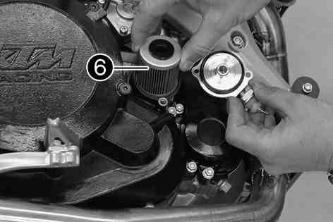 Dispose of oil, grease, filters, fuel, cleaning substances, brake fluid, batteries, etc. according to regulations. Remove the front fuel tank. ( p. 56) Place a suitable container under the engine.