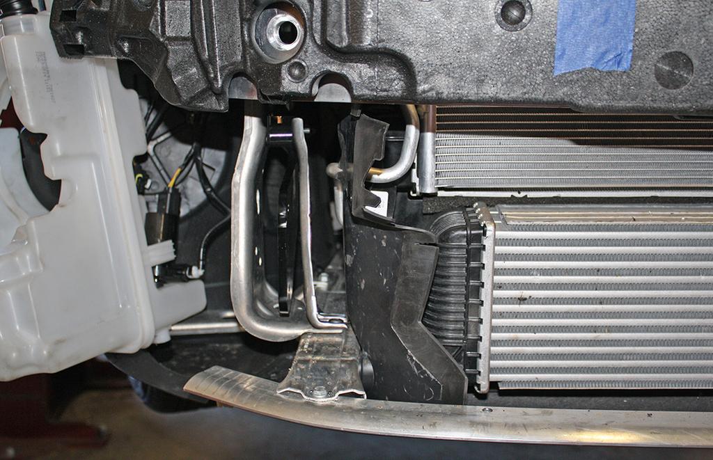 Then, on each side, trim the air deflector as shown (Fig.O). It should be trimmed approximately flush with the intercooler once it is trimmed. 10.