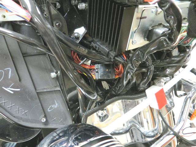 This connector is located on the inside of the right (sitting on bike) fairing support bracket, below the radio. PIC 11 Disconnect the OEM 12-Pin connector.