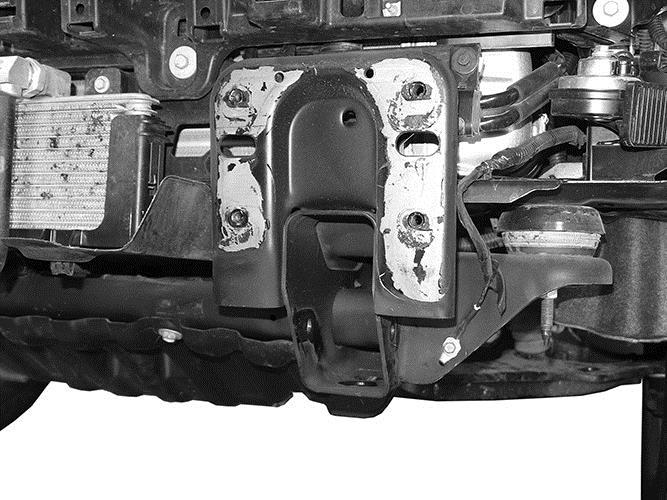 Reuse the (8) factory bumper bracket bolts to attach the Winch Tray assembly to the ends of the frame, (Figures 6 & 7). Snug but do not fully tighten hardware at this time.