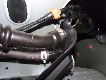 d. Remove plastic clip, clamp, large vent hose, and small vent hose from fuel filler.