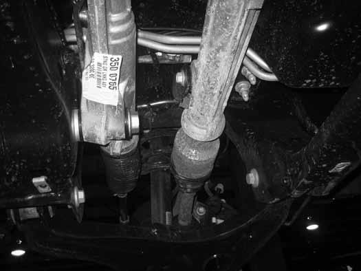 Remove the rear driver s side and one passenger s side differential mounting bolts (Fig 13a, 13b) and remove the
