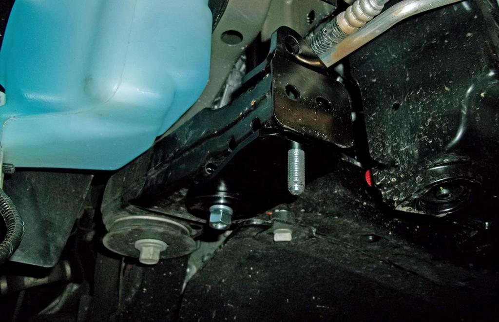 On each side, using one of the supplied ½" x 1½" bolts, bolt down through the pre-existing hole in the top of the subframe and