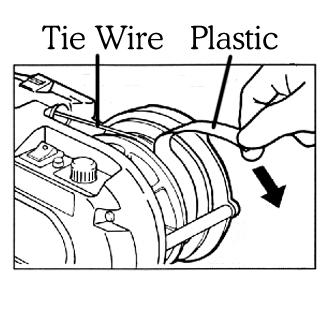 Install the wire coil with the left side facing the tool. Lock the opening by closing the reel holder.