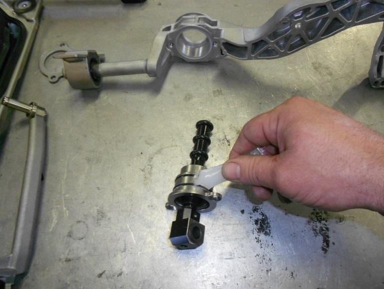 Remove the factory shifter from the housing by unbolting the two 10mm bolts