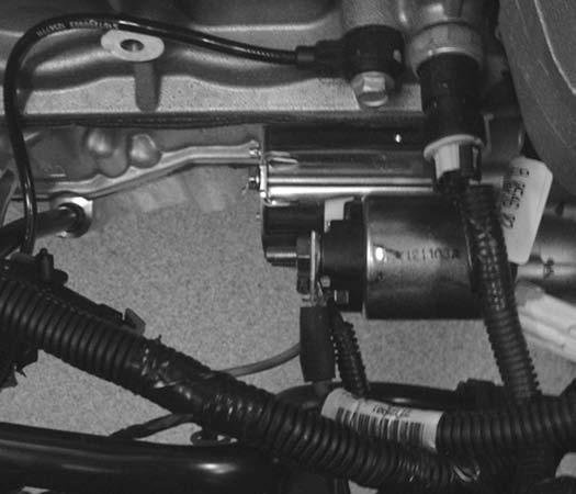 32 GM SPORT COMPACT Performance Build Book 32. Loosen the starter wire bolt and reposition the wire. (Fig. 25) where the previous two short studs were located.