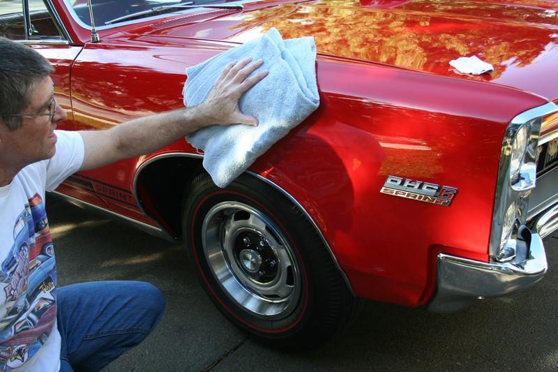 Photo 12 - After using the clay bar on the remainder of the front fender we buffed it dry with a