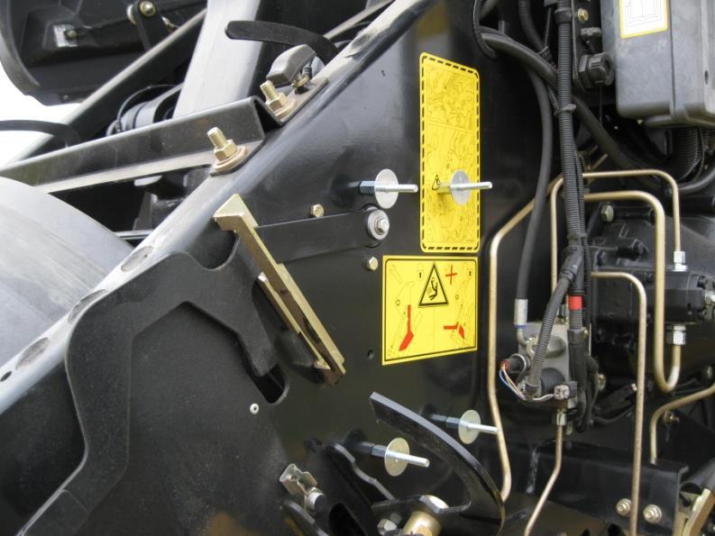 Locate the four holes by the fly wheel brake. (Figure 5) 4.