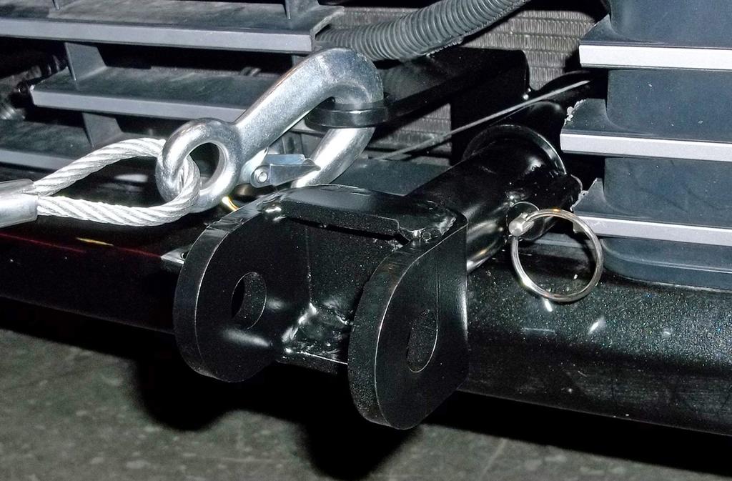 Install the tow bar to the mounting bracket according to the manufacturer's instructions. IMPORTANT! Safety cables are required by law.