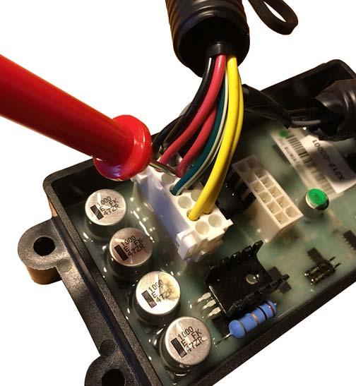 c. Position the black probe on the engine block. d. Turn ignition key to ON position. e. Turn the potentiometer from low-idle to full throttle. Voltage to the red wire should measure 4.90 V DC 5.