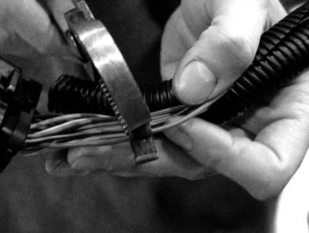 Secure the sensor with a zip tie and make sure there is no binding in the cable and that the cable has engaged fully into the sensor.