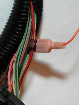 This harness has one 16 pin connector and one 12 pin connector. The adapter box will attach to the 16 pin connector. The speedometer will attach to the 12 pin connector.