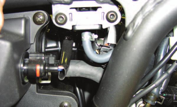 4 Unplug the stock wiring harness from the throttle body (Fig. A). FIG.