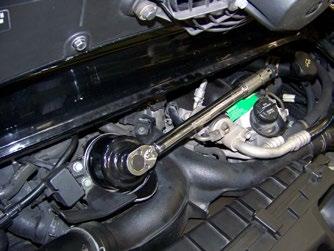 Oil Change Service - Step 12 Using the correct oil filter tool (ES1355436), tighten the filter cap and
