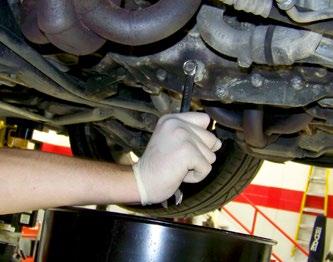 Oil Change Service - Step 2 Using a 15mm wrench, loosen and remove the main engine