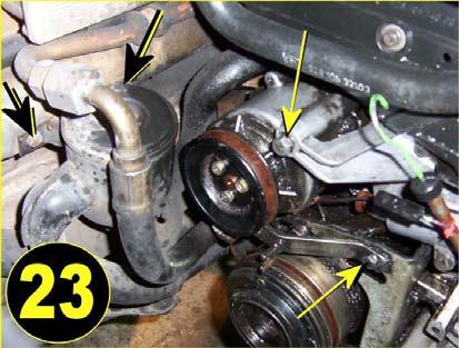 Removal of EGR Air Pump: Remove the smog pump itself by taking out the 13mm bolts, (as shown in picture 23) at the