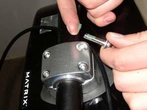 Apply a thin layer of grease to the threads of the four clamp bolts Install the clamp and finger tighten