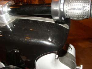 the top of the Cover AND the slight bends in the handlebars are angled toward to rider compartment and up