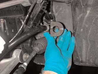 attaching the top of the anti-sway bar end links to the anti-sway bar.