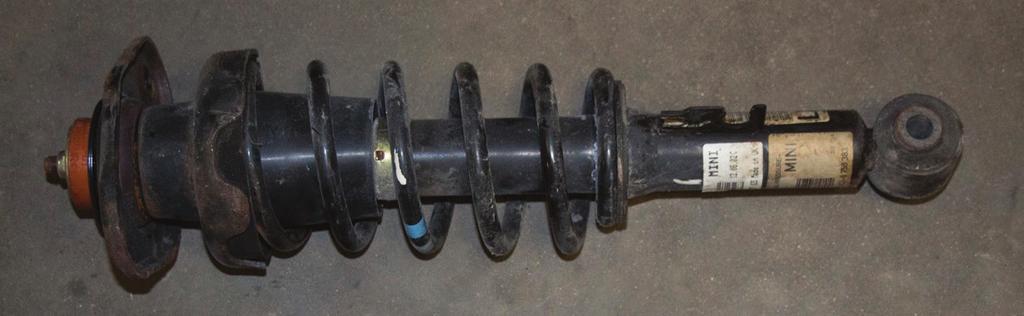 shock assembly from the vehicle. (figs. 5-7). fig.