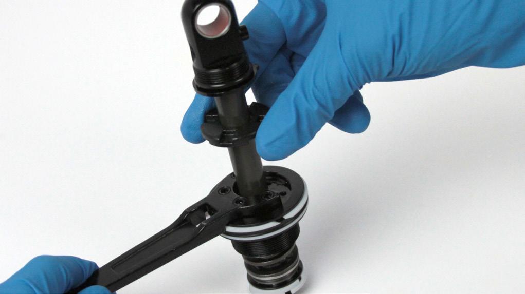 A small amount of grease on the tip of the TORX wrench will keep the bleed screw in place while installing it.