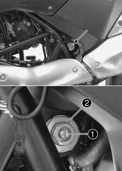 MAINTENANCE WORK ON CHASSIS AND ENGINE 68 Turn the adjusting screw clockwise with a screwdriver until it stops. Do not loosen nut!