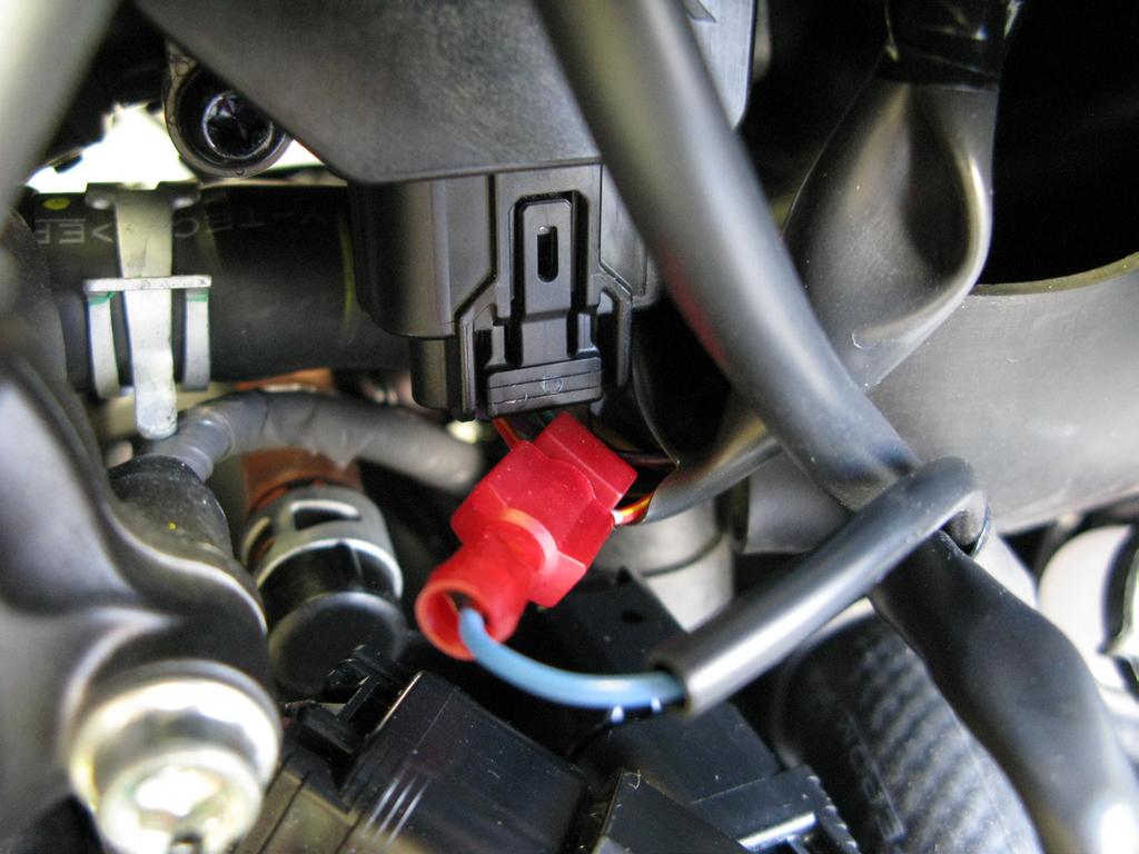 Locate the Throttle Position Sensor (TPS) and connector. 3.