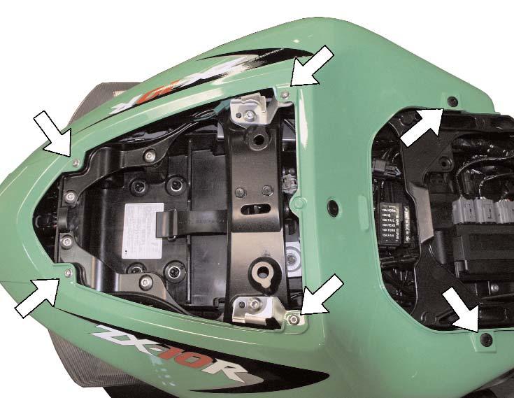 2) Remove the bolt securing the right side cover to the motorcycle. Pull firmly on the cover to release it from the mounting grommets, and set aside.