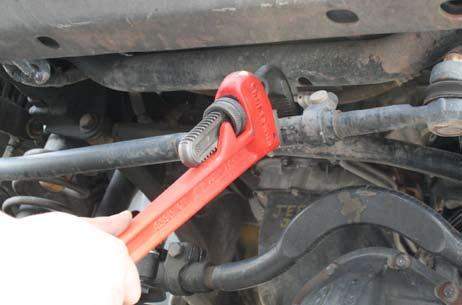 To align the front track bar have someone move the steering wheel until the bolt hole lines up. Torque to 125 ft-lbs.