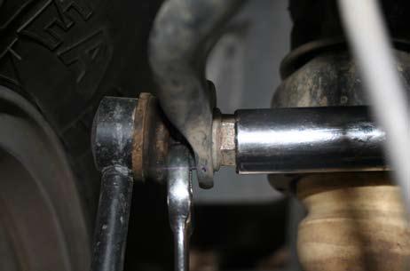 Loosen all control arm bolts using a 21mm socket, DO NOT REMOVE ARMS OR BOLTS!