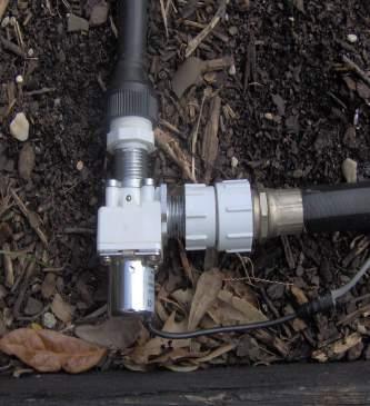 Note the IN and OUT as shown by the provided garden hose fittings already installed. If sand or debris is present in the water, place a filter in-line prior to the valve.