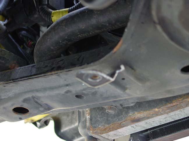 10/ Cut then original intercooler bracket as per the picture below using a hacksaw or small grinding tool.