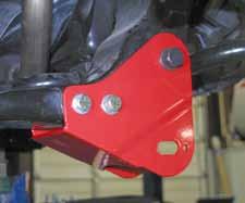 8. Locate the new Skyjacker rear cross member brackets. They will attach to the OEM cross member location using the 1/2" x 5 1/2" fine thread bolts, washers, & nuts.