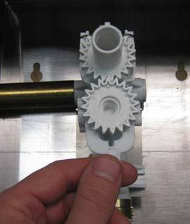 2. Remove the gear retainer and then the gear. Gear retainer 3. Using a flat head screw driver, remove the check valve body and o-ring.