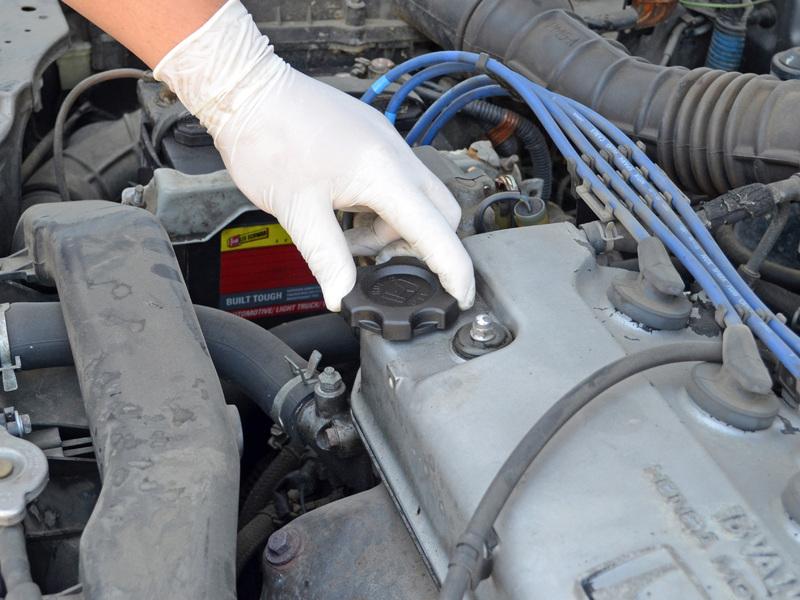 Step 10 Pour 4 quarts of 10W-30 oil* into the engine. Use one hand to stabilize the funnel to help prevent spills. * (Check your owner's manual for correct amount and grade of oil.