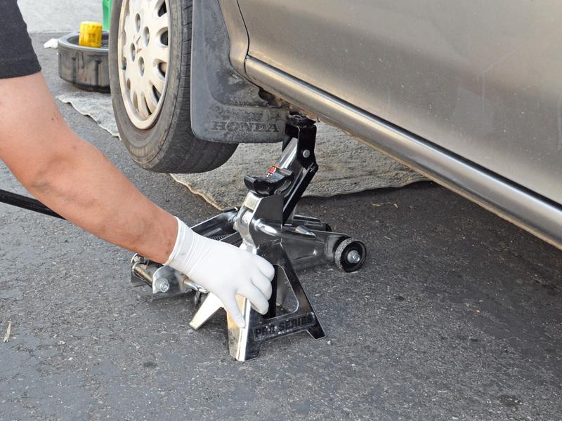 Remove the jack stand from under the car.