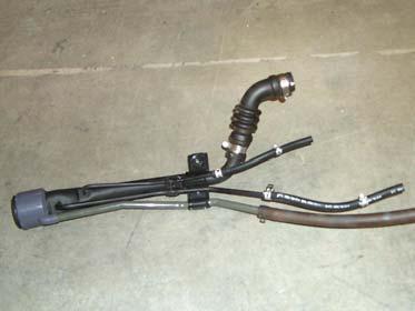 A spark could cause an explosion or fire resulting in serious personal injury and property damage. d. Install two kit hoses (1/4 x 11 ) onto two fuel filler vent tubes with two kit clamps (#10 hose).