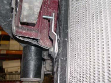Install four kit brackets (radiator) onto radiator with four bolts.