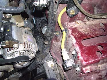 2. Remove nut, bolt, battery tie down, and battery from vehicle. 6.