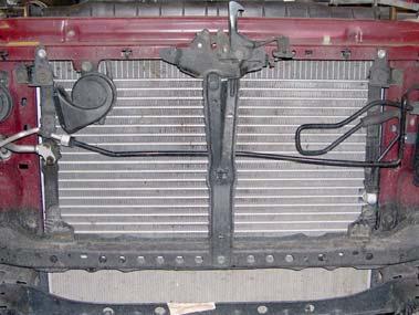 7. Remove four bolts and radiator from core support.