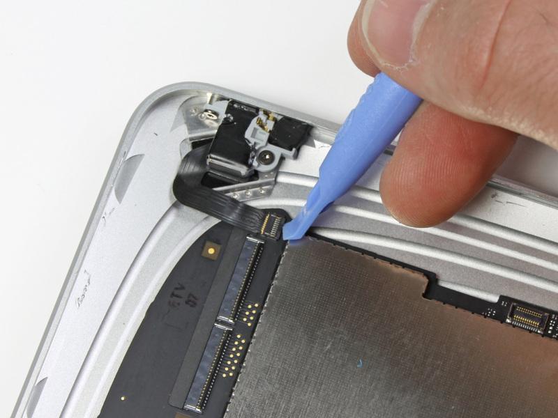 Carefully flip up the ZIF ribbon cable retaining flap on the socket near the headphone