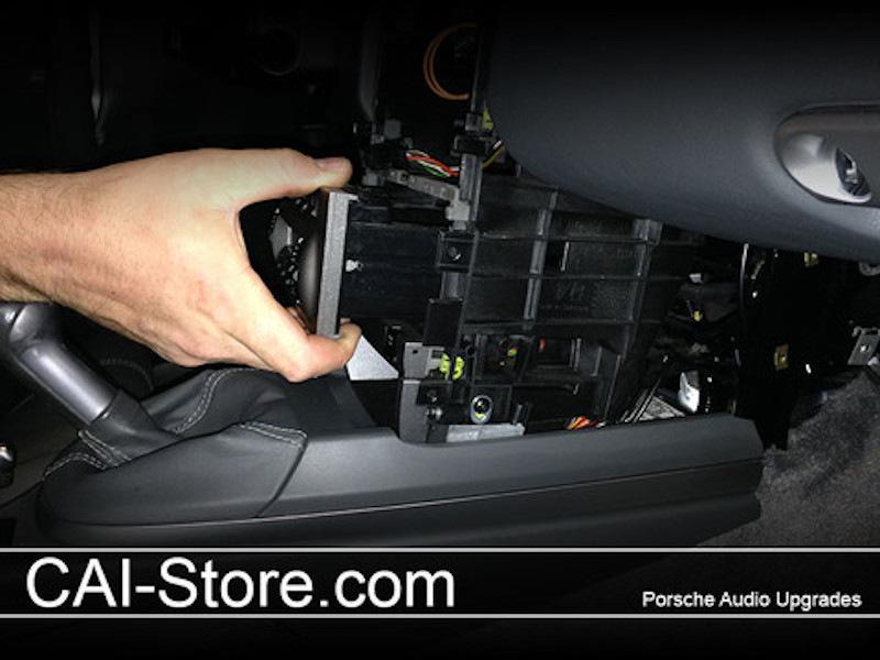 Unplug and set aside. Tip: cover your center console and shifter with a towel to avoid scratches. There are a few connections that need to be made outside of the radio cavity.