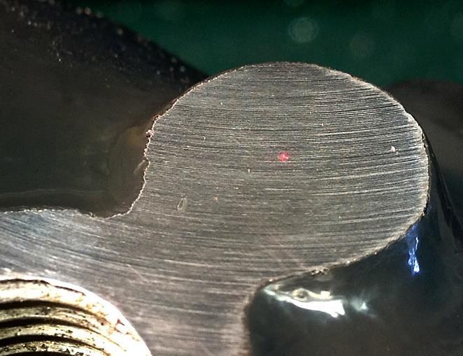 I surfaced the boss in preparation to drilling and tapping the mounting hole and used my laser center finder to eyeball the location of the hole (the small red dot.