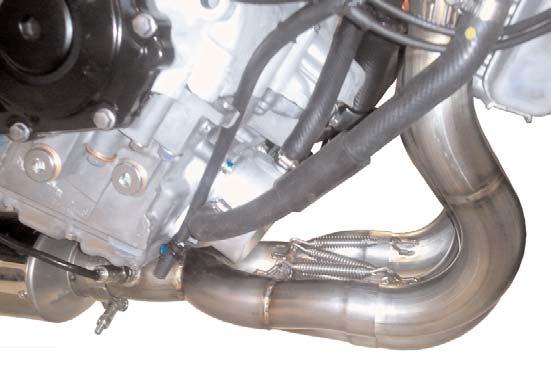 34)Apply a liberal amount of high temperature silicone sealant to the inside of the Muffler Assembly inlet tube, and slide the muffler assembly over the headpipe collector outlet. (Fig.