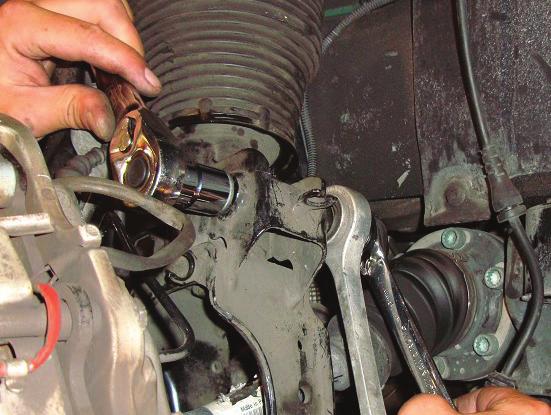 7. REMOVE THE SWAY BAR END LINK TO SHOCK MOUNTING NUT AND BOLT.