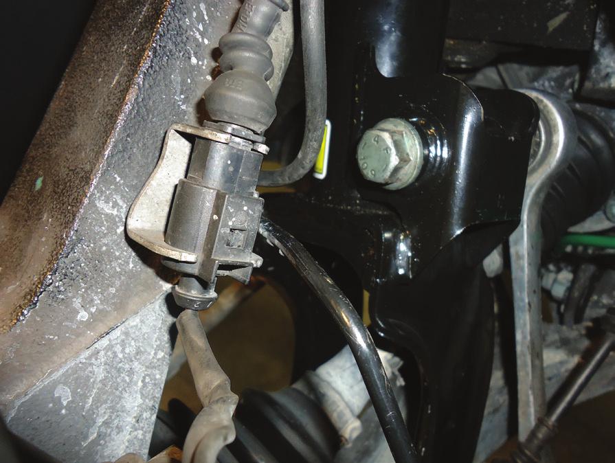 REMOVE AND DISCONNECT THE SHOCK DAMPER SENSOR WIRE.