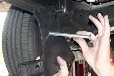 bolts and loosening the rear bolts (Fig.H).