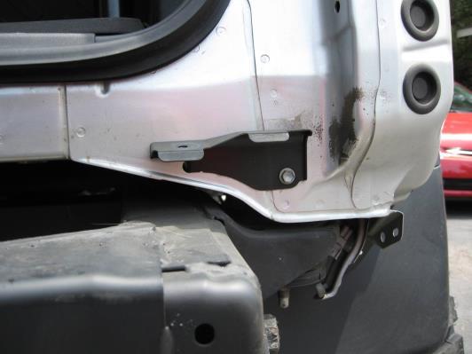 ) Use a 12mm socket to remove the outmost bumper brackets from the rear