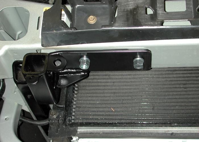 Insert the rear portion of the brace between the frame rail and the wiring harness (Fig.N; passenger side only). Fig.O Fig.P Fig.Q 15.